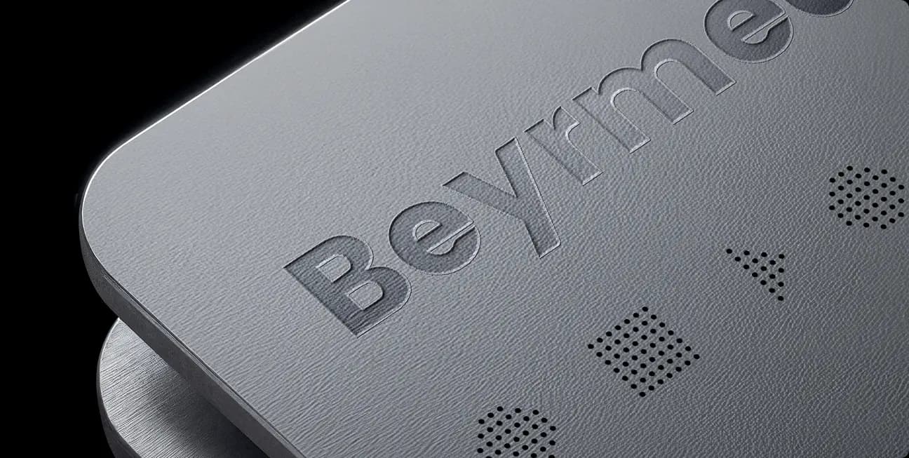 Beyrmedia embossed wordmark on a textured surface