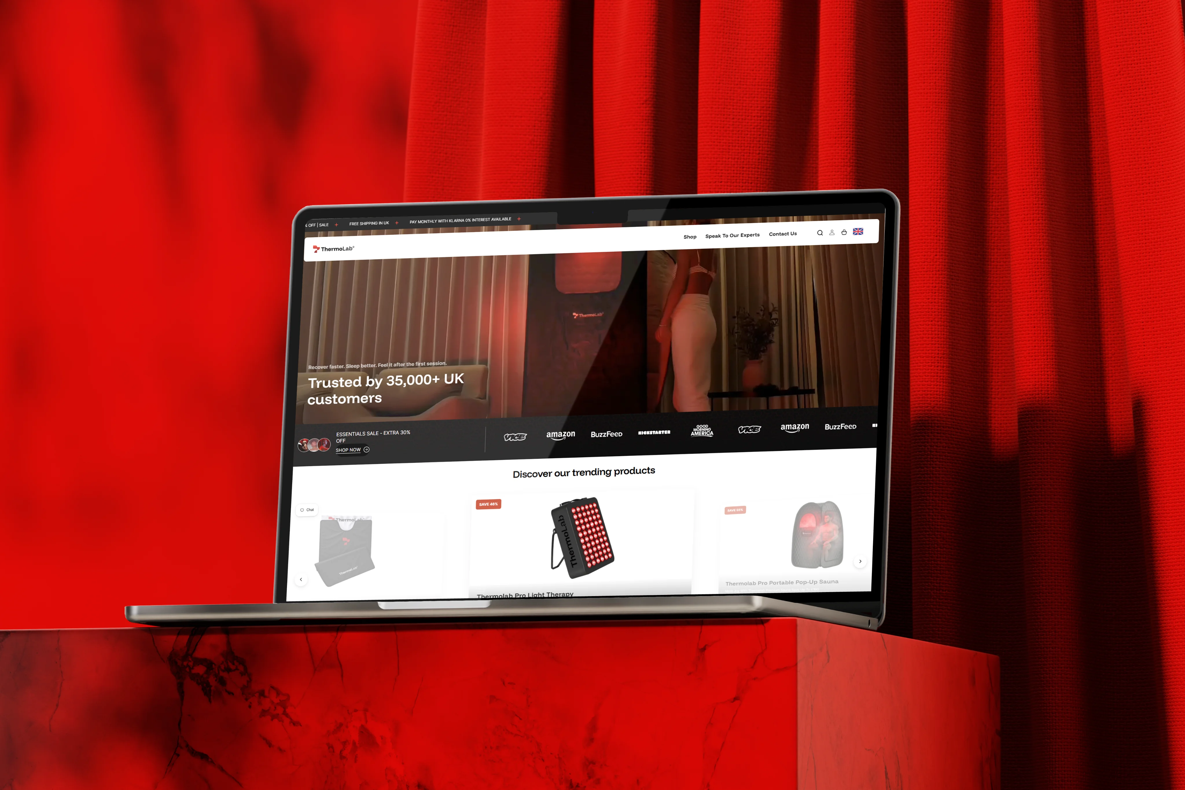 ThermoLab wellness Shopify store displayed on a laptop against a red background